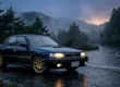 Subaru Legacy RS Turbo azul escuro estacionado em uma estrada de montanha ao anoitecer.